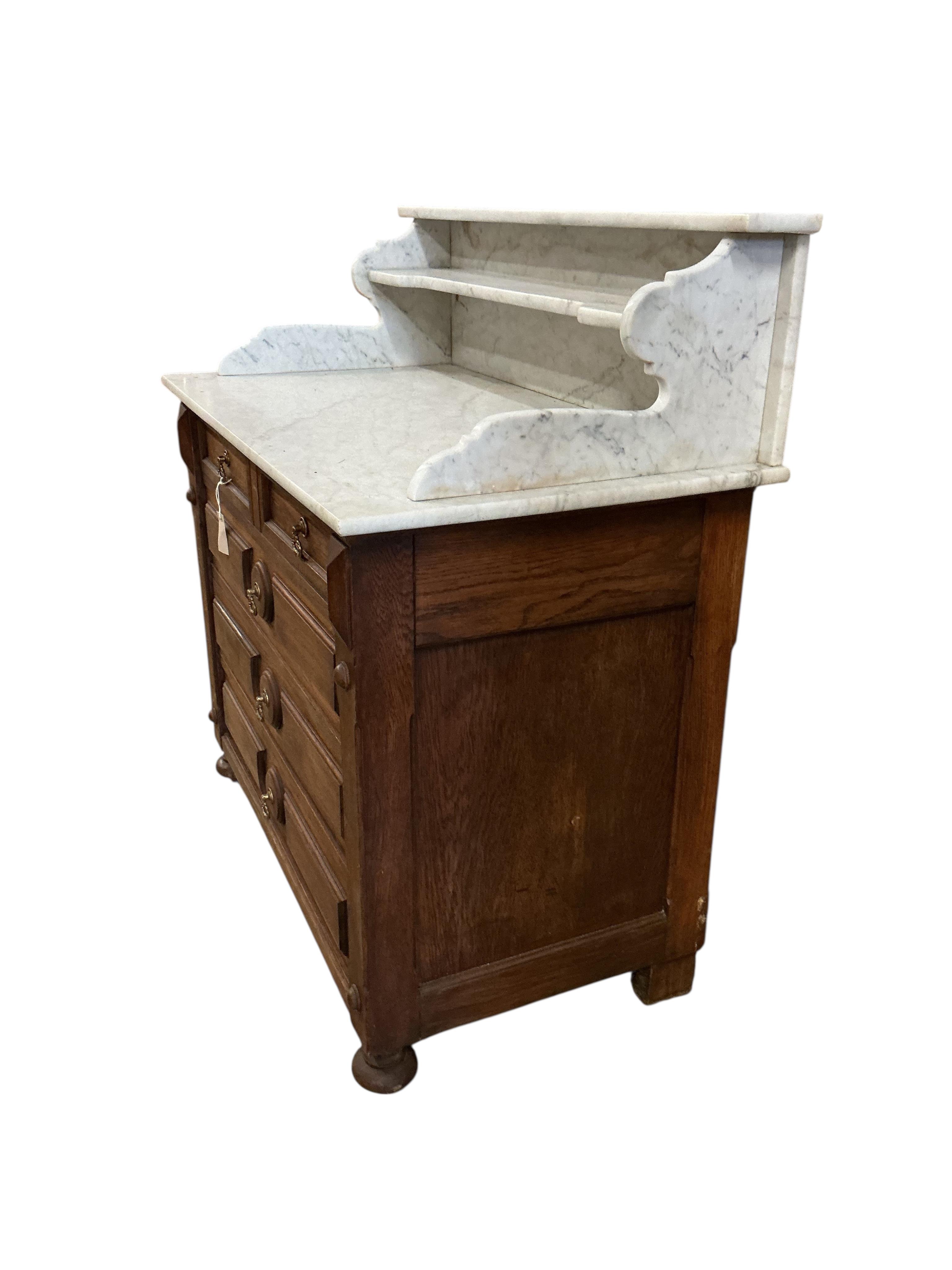 A late 19th century French oak marble top washstand, width 106cm, depth 58cm, height 112cm